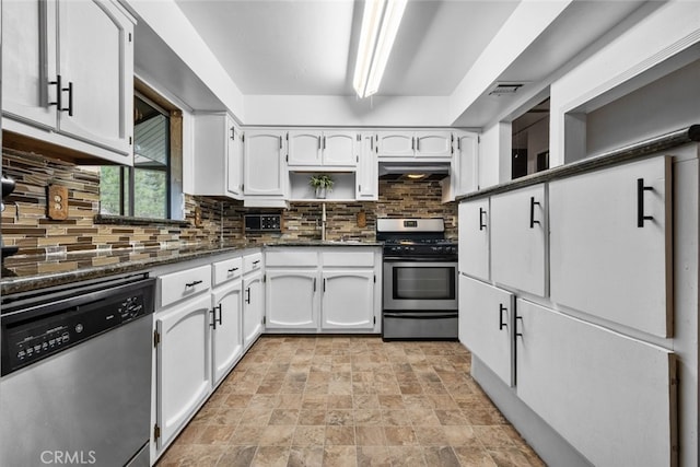 kitchen with stainless steel appliances, backsplash, visible vents, and white cabinets