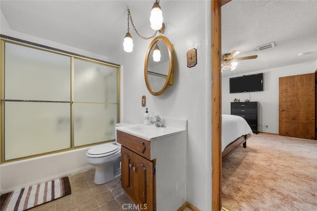 full bathroom with a textured ceiling, toilet, bath / shower combo with glass door, vanity, and visible vents