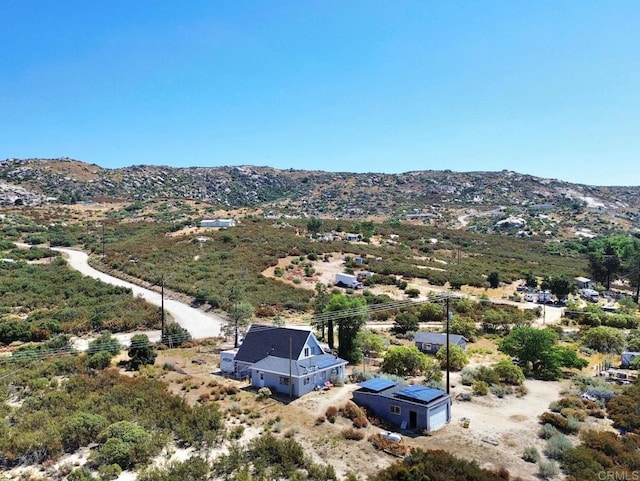 birds eye view of property with a mountain view