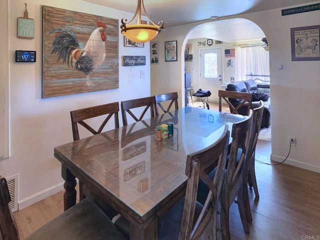 dining area featuring hardwood / wood-style floors