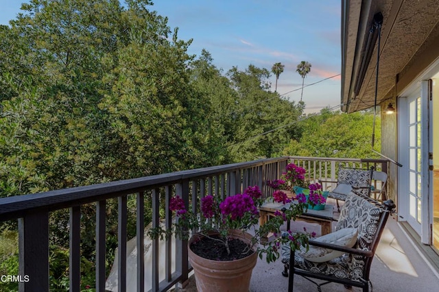 view of balcony at dusk