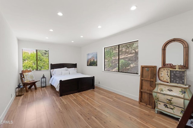 bedroom with light hardwood / wood-style floors