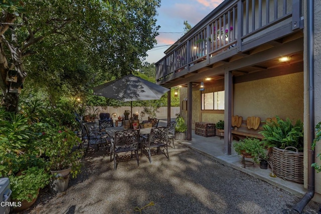 view of patio terrace at dusk