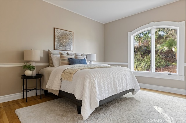 bedroom featuring hardwood / wood-style flooring