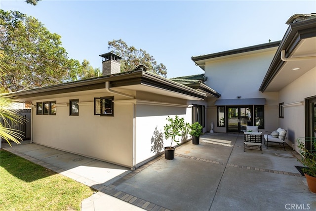 back of property with a patio area