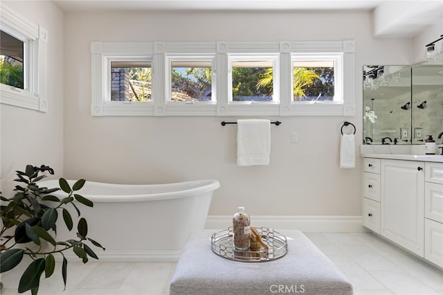 bathroom featuring vanity, tile patterned floors, plenty of natural light, and separate shower and tub