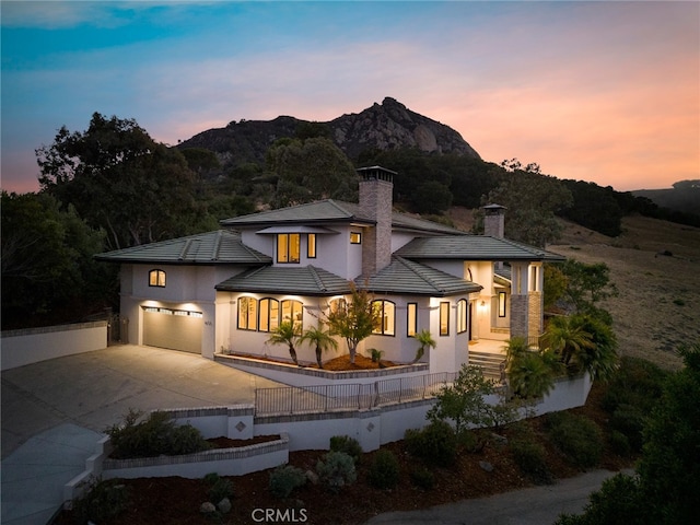 view of front of house featuring a mountain view and a garage