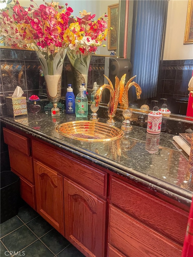 kitchen with sink and dark tile patterned floors