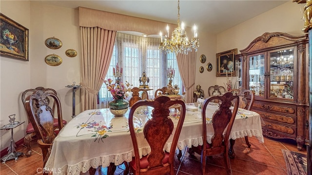 tiled dining area with a chandelier