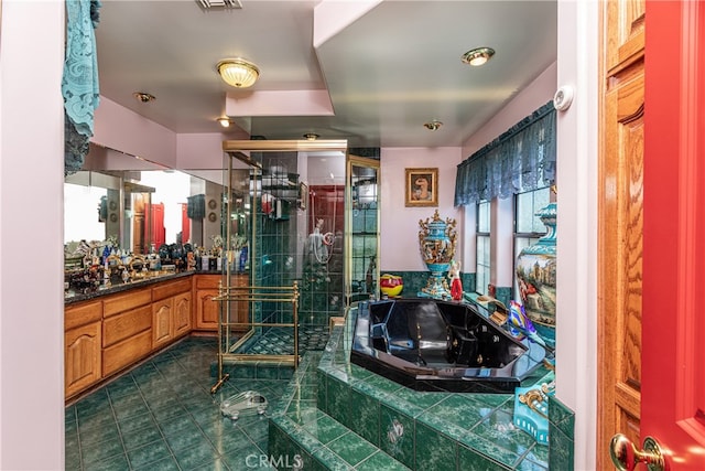 bathroom featuring vanity and separate shower and tub