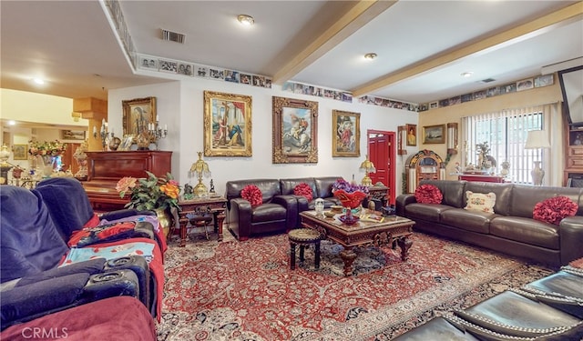 living room featuring beamed ceiling