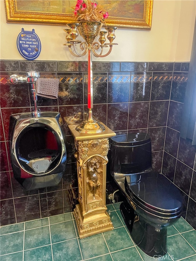 bathroom with tile walls and toilet