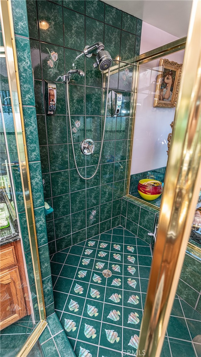 bathroom featuring a shower with shower door and tile patterned floors