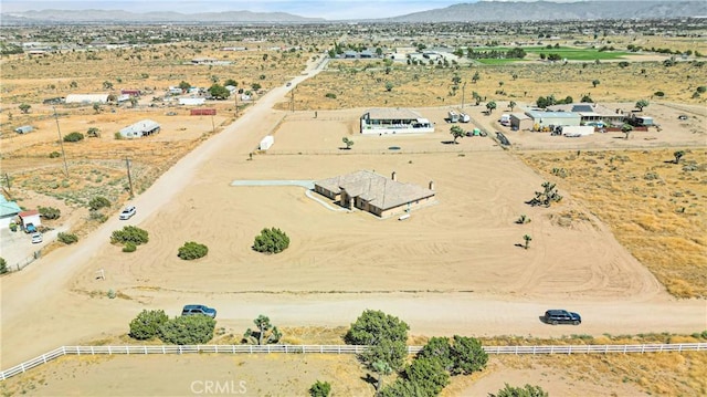 drone / aerial view featuring a mountain view and a rural view