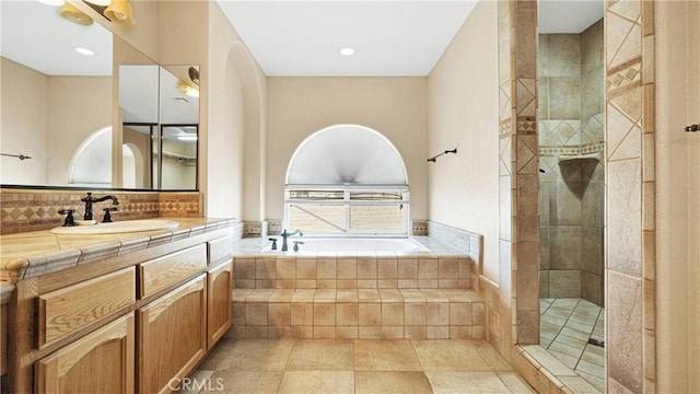 bathroom featuring ceiling fan, decorative backsplash, shower with separate bathtub, and vanity