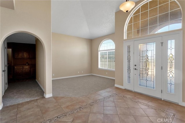 entryway with light colored carpet