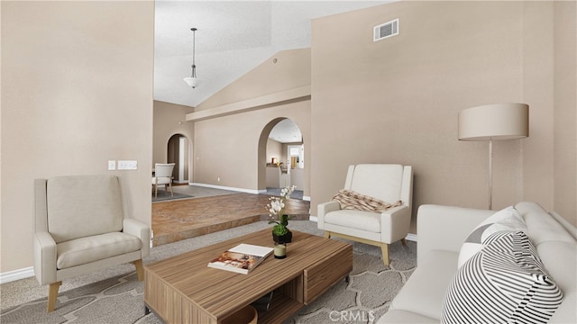 living room with lofted ceiling and carpet flooring