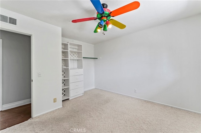 unfurnished bedroom featuring a closet, ceiling fan, and light colored carpet