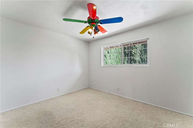 unfurnished room with ceiling fan and light colored carpet