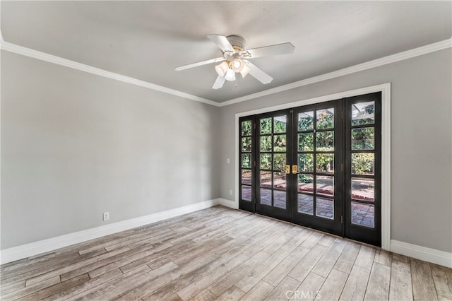 spare room featuring light wood-type flooring, ornamental molding, ceiling fan, and french doors