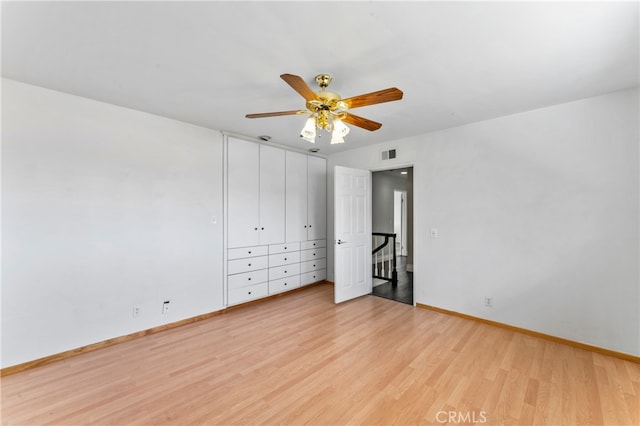 unfurnished bedroom with light hardwood / wood-style floors and ceiling fan