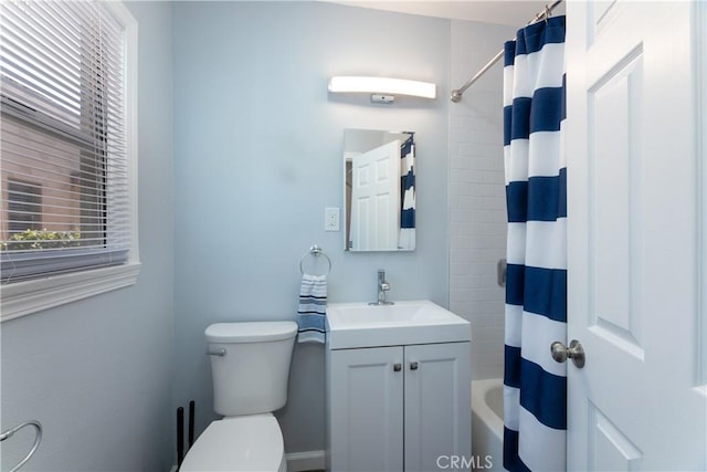 full bathroom with vanity, shower / bathtub combination with curtain, and toilet