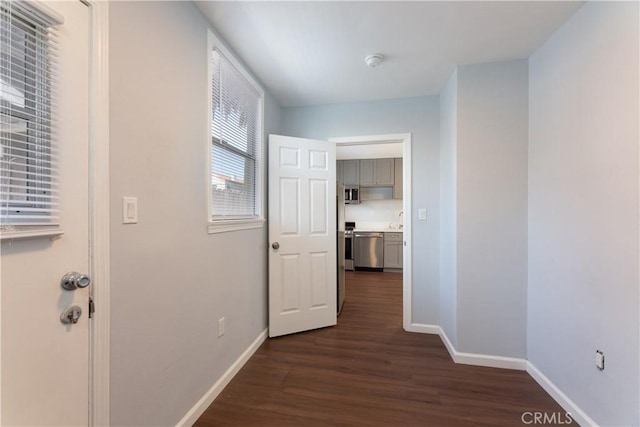 corridor featuring dark hardwood / wood-style floors