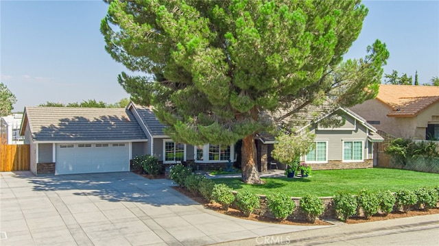 view of front facade with a garage and a front yard