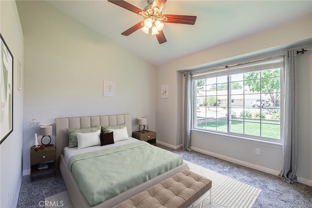 bedroom with ceiling fan, vaulted ceiling, and carpet