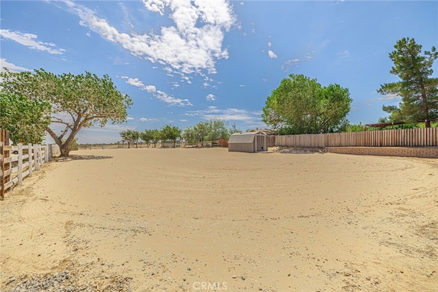 view of yard with a storage unit