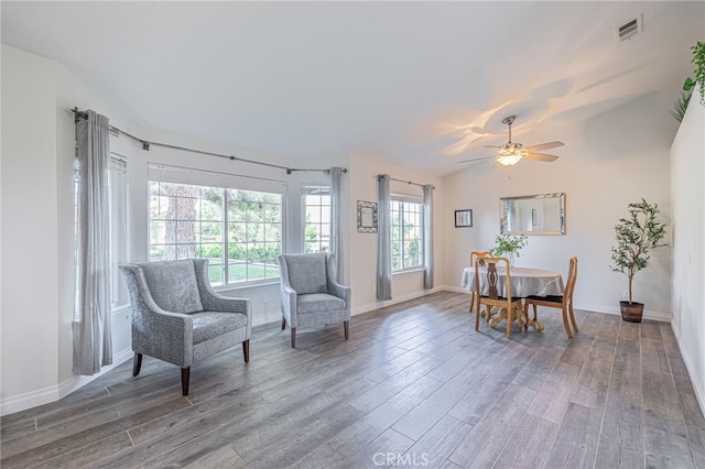 sitting room featuring lofted ceiling, dark hardwood / wood-style flooring, and ceiling fan