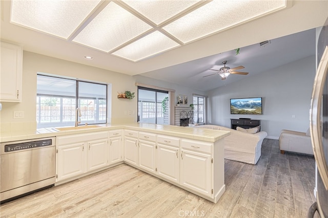 kitchen featuring ceiling fan, white cabinets, sink, kitchen peninsula, and stainless steel dishwasher