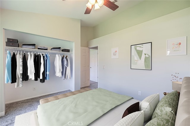 carpeted bedroom featuring ceiling fan and a closet