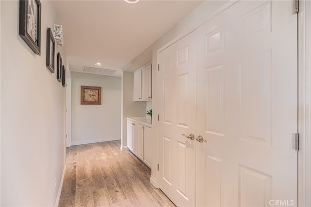 hall with light hardwood / wood-style flooring