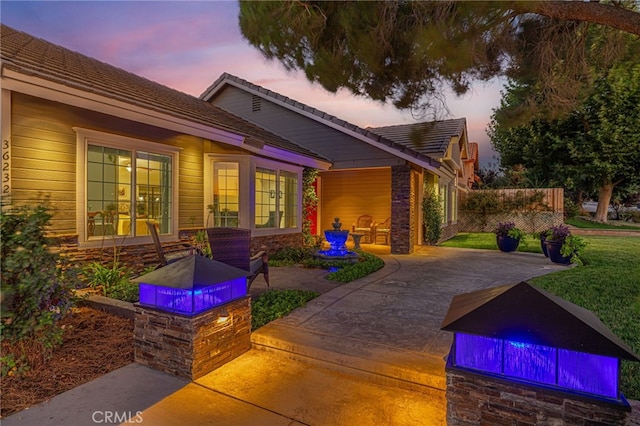 view of front of property with a lawn