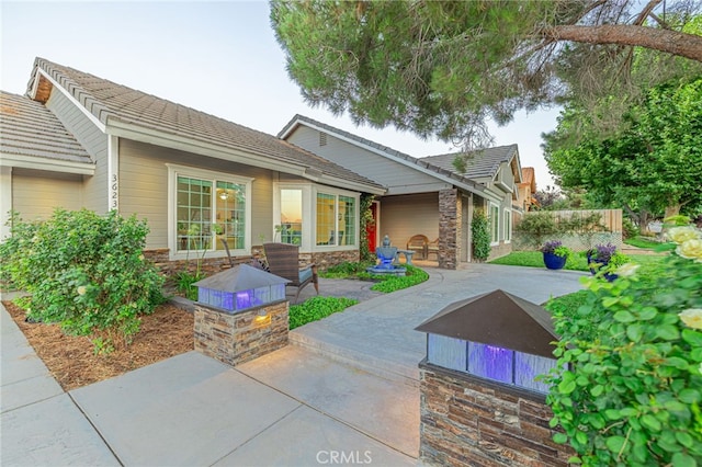 view of front of home featuring a patio