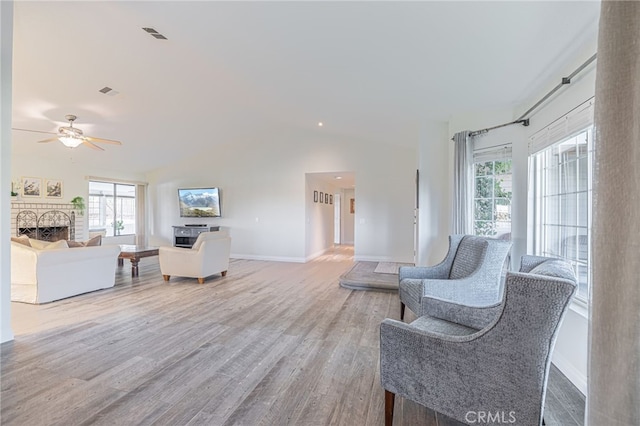 interior space featuring wood-type flooring, vaulted ceiling, and ceiling fan