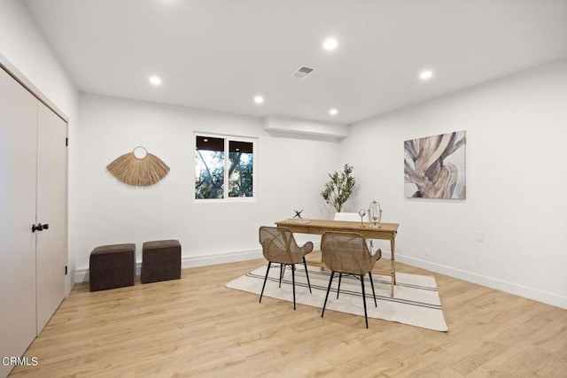 dining area with light hardwood / wood-style floors