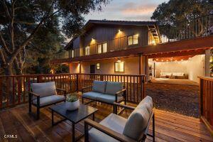 deck at dusk with an outdoor living space