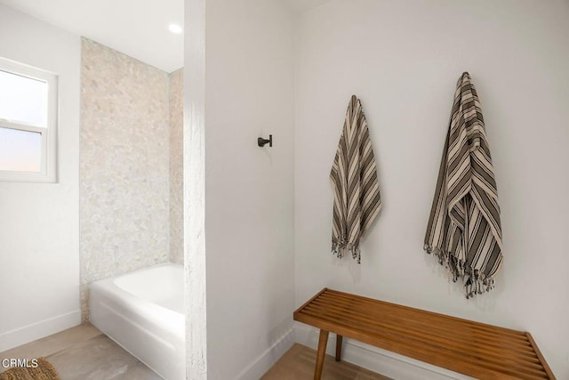 bathroom featuring a washtub