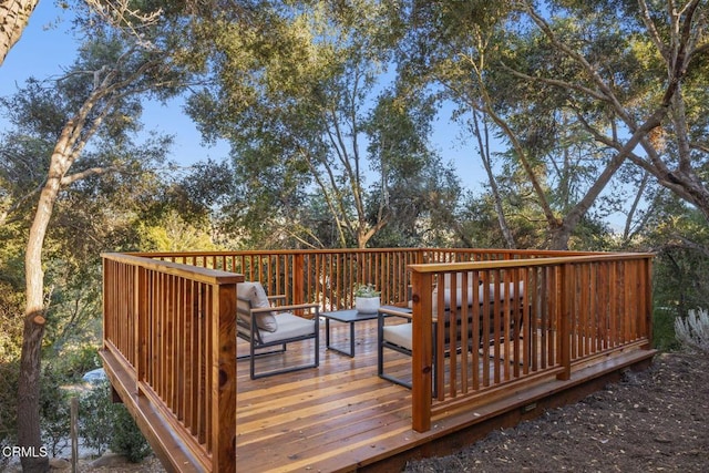 wooden deck with an outdoor hangout area