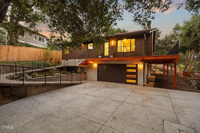 view of front of house with a balcony and a garage