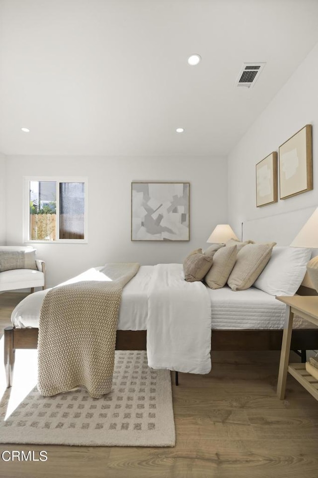 bedroom featuring hardwood / wood-style floors