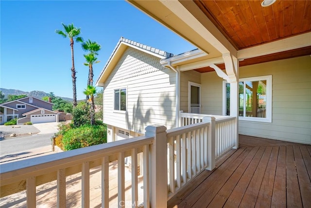 wooden deck with a mountain view