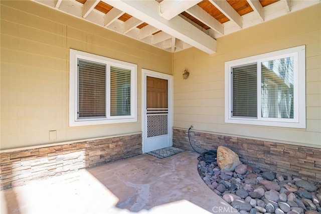 doorway to property featuring a patio area