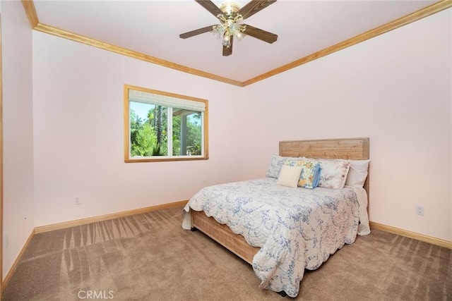 bedroom with ceiling fan, ornamental molding, and carpet floors