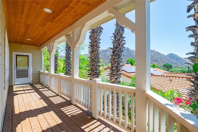 wooden terrace with a mountain view