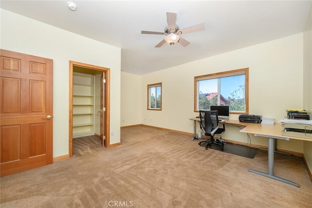 office with light colored carpet and ceiling fan