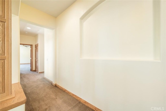 hallway with carpet floors