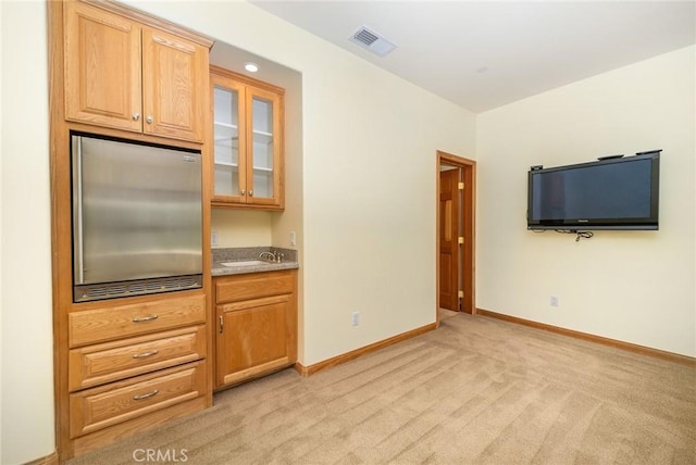 kitchen with light carpet